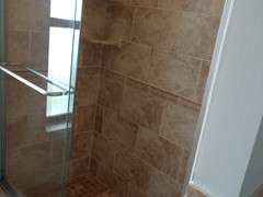 Guest Bath tile shower and sliding glass door.